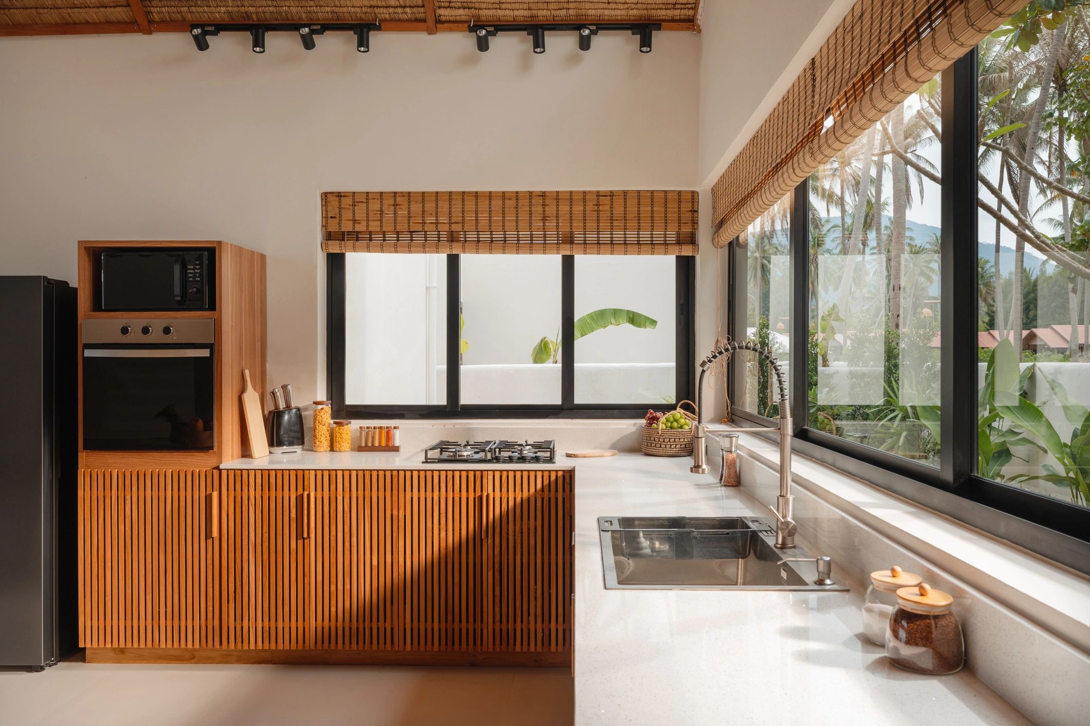 Sunlit modern wooden kitchen with clean countertops
